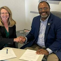 Kelley Rich, interim vice president and associate provost for innovation at the University of Notre Dame shakes hands with Rodney Ridley, chief operating officer of the  O’Pake Institute and vice president of research, economic development and innovation at Alvernia University