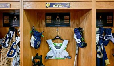 Lacrosse equipment in a wooden locker