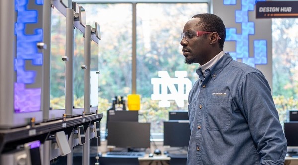 Current ESTEEM program student Sam Kibirige works with 3D printers in the IDEA Center's Innovation Lab.